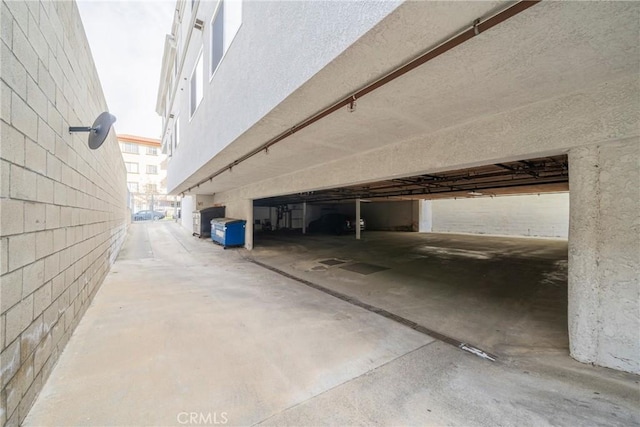 view of side of home with a parking garage