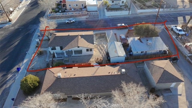 birds eye view of property with a residential view