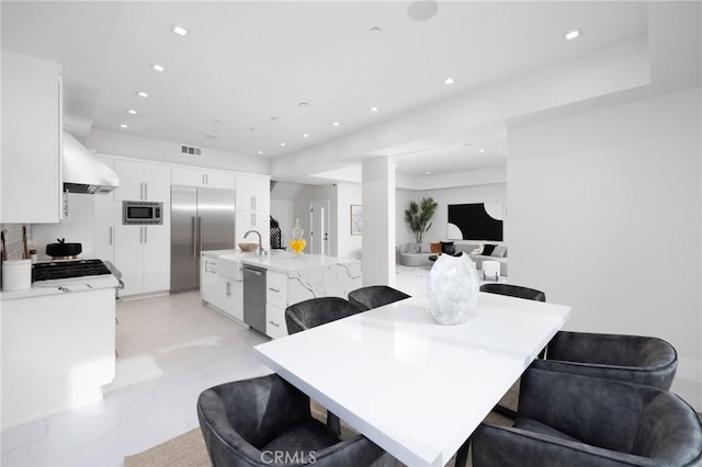 dining area with marble finish floor, visible vents, and recessed lighting