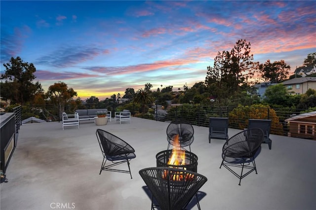 view of patio / terrace featuring an outdoor living space with a fire pit