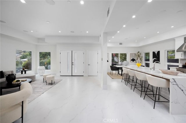 interior space with recessed lighting, visible vents, and plenty of natural light