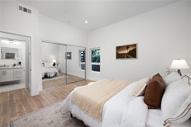 bedroom featuring recessed lighting, visible vents, baseboards, a closet, and light wood finished floors