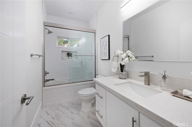 bathroom with enclosed tub / shower combo, marble finish floor, vanity, and toilet