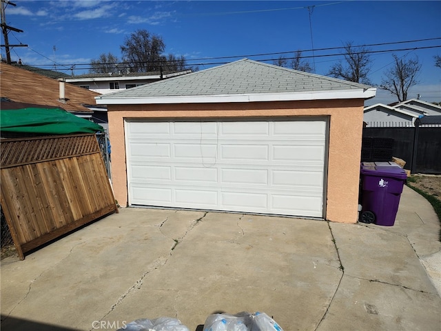 detached garage with fence