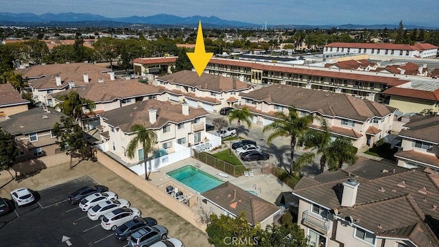 drone / aerial view featuring a mountain view and a residential view