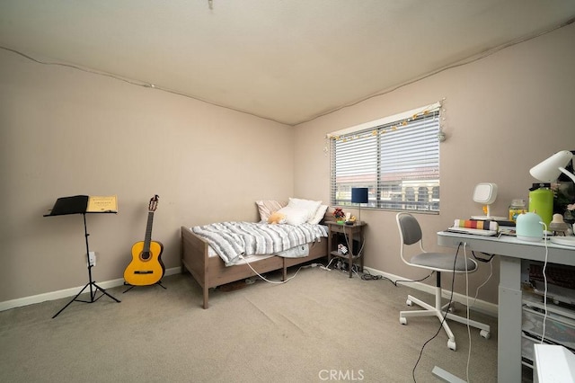 carpeted bedroom featuring baseboards