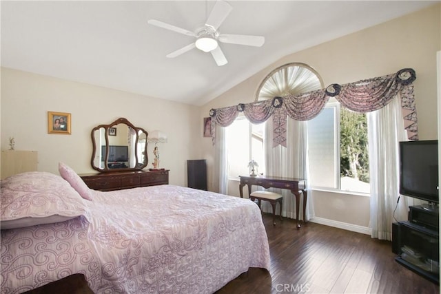 bedroom with lofted ceiling, ceiling fan, baseboards, and dark wood finished floors