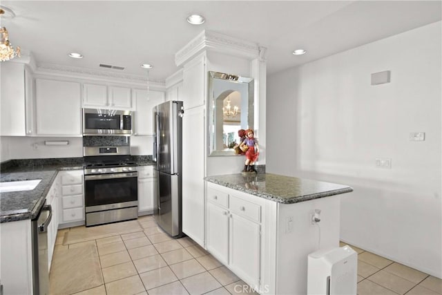 kitchen with white cabinetry, visible vents, light tile patterned floors, and appliances with stainless steel finishes