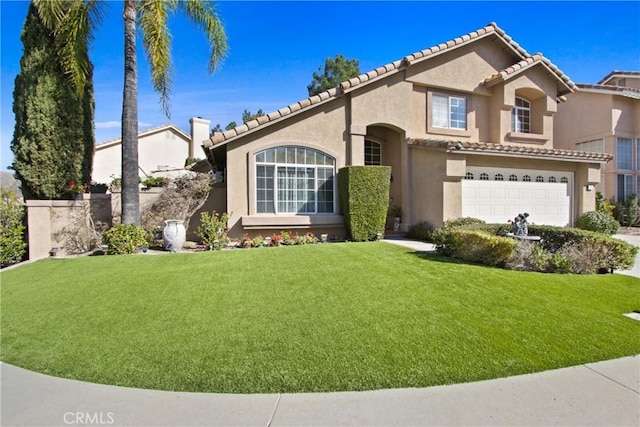 mediterranean / spanish-style home with a front yard, a tile roof, an attached garage, and stucco siding