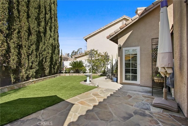 view of yard featuring a patio area and fence