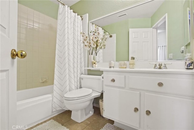 full bathroom with tile patterned flooring, toilet, visible vents, vanity, and shower / tub combo with curtain