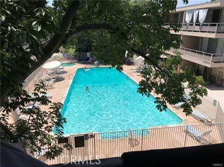 pool featuring a patio area and a hot tub