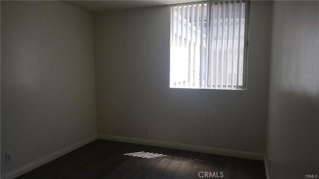 empty room with baseboards