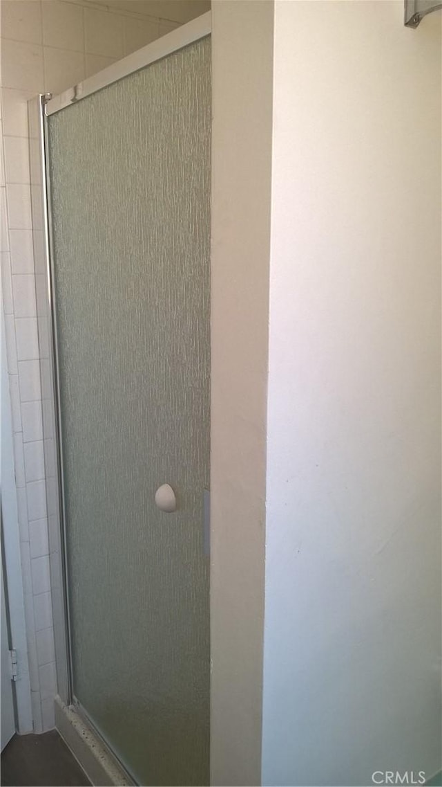 bathroom with a shower stall