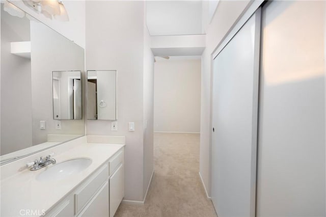 bathroom featuring baseboards and vanity