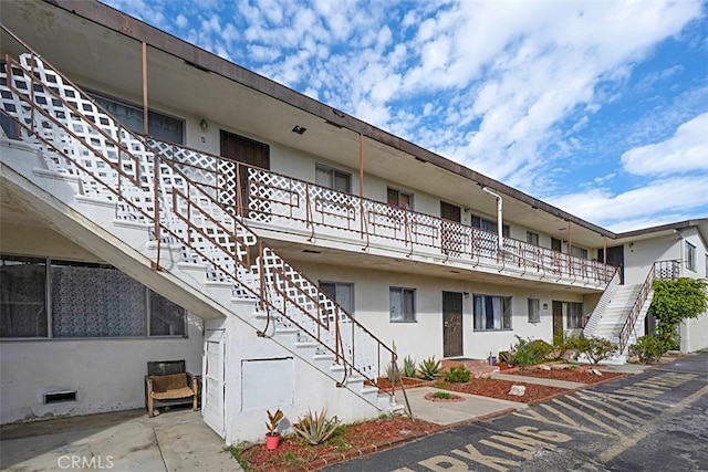 view of property featuring stairs