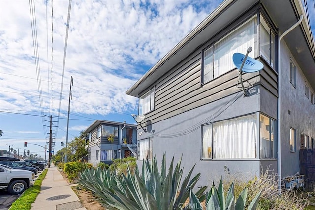 view of side of home featuring stucco siding