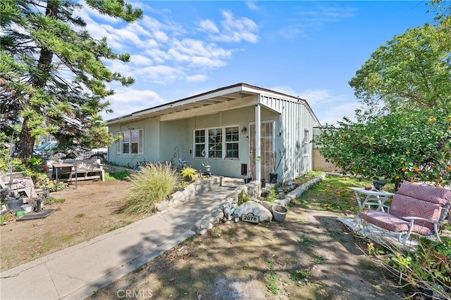 view of front of house featuring stucco siding