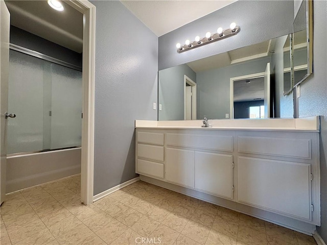 full bathroom featuring enclosed tub / shower combo, vanity, and baseboards