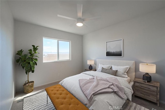 bedroom featuring carpet floors, baseboards, and a ceiling fan