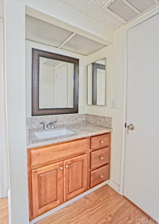 933 New Depot St Unit 6 & 7, Los Angeles, CA 90012 - bathroom featuring wood finished floors and vanity