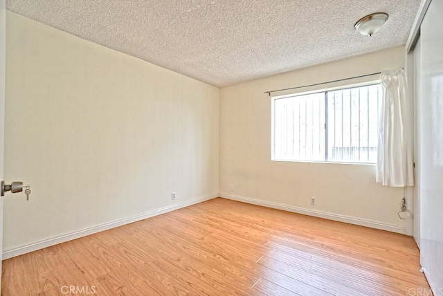 933 New Depot St Unit 6 & 7, Los Angeles, CA 90012 - empty room with light wood-style floors and a textured ceiling