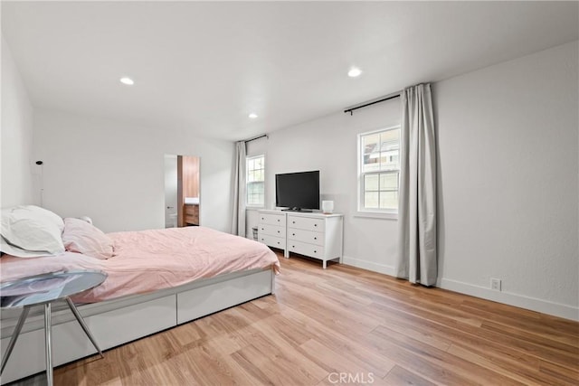 bedroom featuring light wood-type flooring, baseboards, and recessed lighting