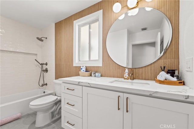 full bath featuring wood walls, vanity, toilet, and shower / bathtub combination