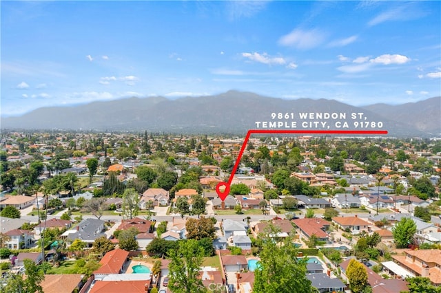 drone / aerial view with a residential view and a mountain view