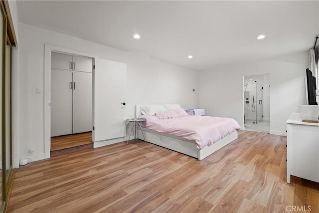 bedroom with baseboards, recessed lighting, connected bathroom, and light wood-style floors