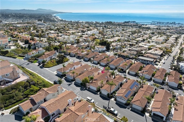 birds eye view of property with a water view and a residential view