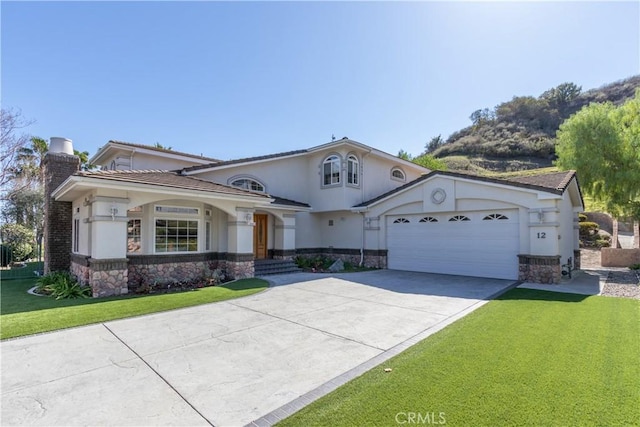 mediterranean / spanish-style home featuring a garage, a front yard, stone siding, and a chimney