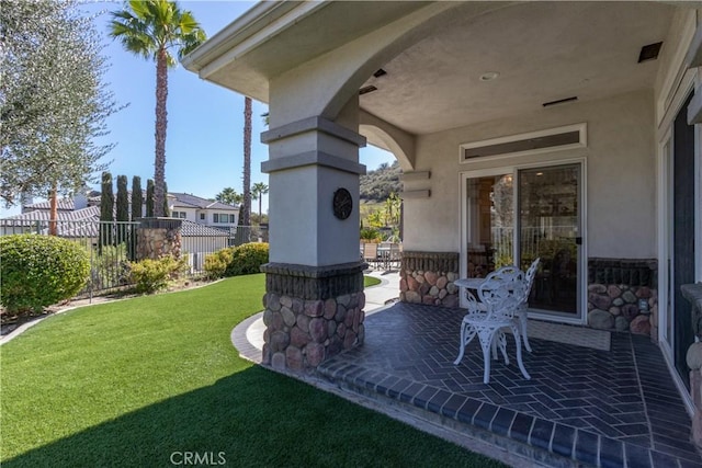 view of yard featuring fence and a patio