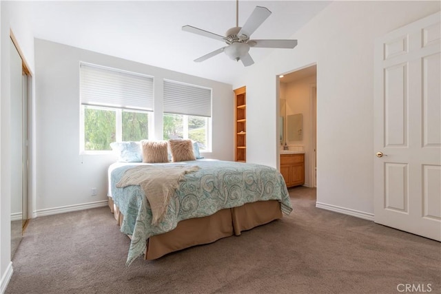 bedroom with ceiling fan, baseboards, and carpet flooring