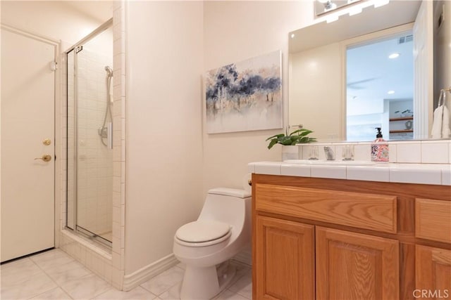 full bathroom with a stall shower, vanity, and toilet