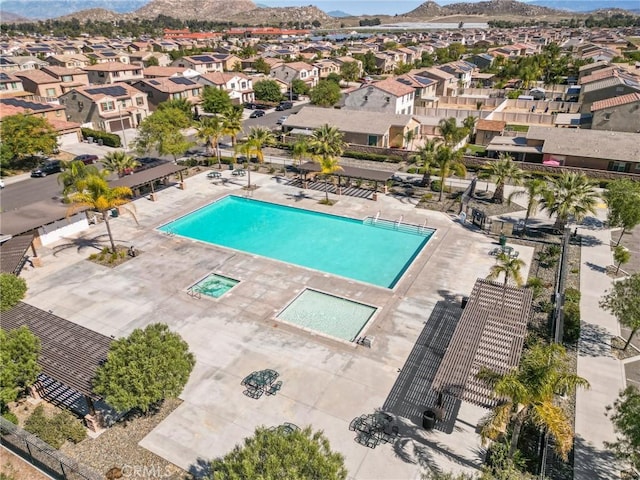 view of pool featuring a residential view and a mountain view