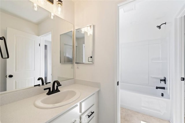 full bath featuring shower / bathing tub combination, tile patterned flooring, and vanity