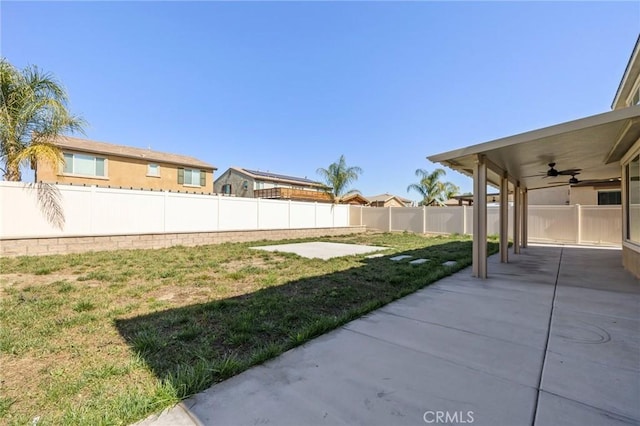 view of yard featuring a patio area, a fenced backyard, and ceiling fan