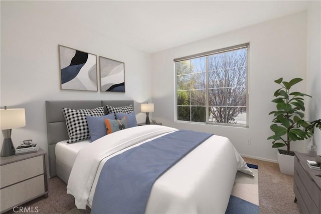 bedroom with carpet flooring and baseboards