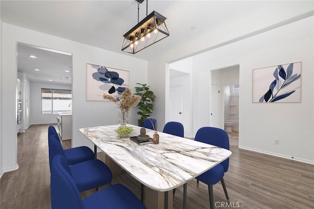 dining space with recessed lighting, wood finished floors, and baseboards