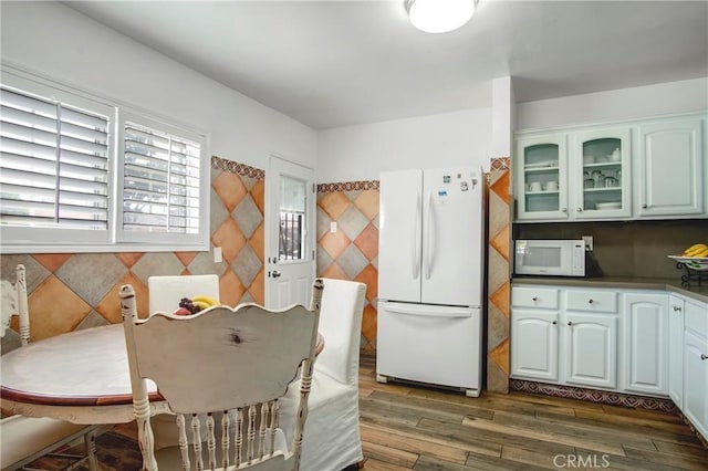 dining area featuring dark wood-type flooring