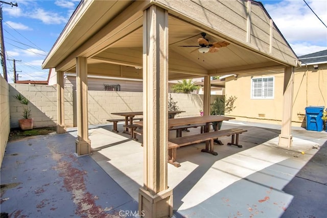 view of patio with a fenced backyard, a ceiling fan, and a gazebo