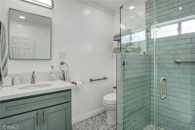 bathroom with crown molding, a stall shower, vanity, toilet, and tile patterned flooring