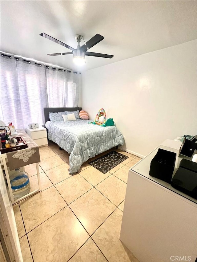 bedroom with light tile patterned flooring and ceiling fan