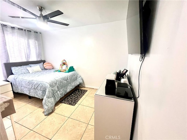 bedroom with light tile patterned floors and a ceiling fan