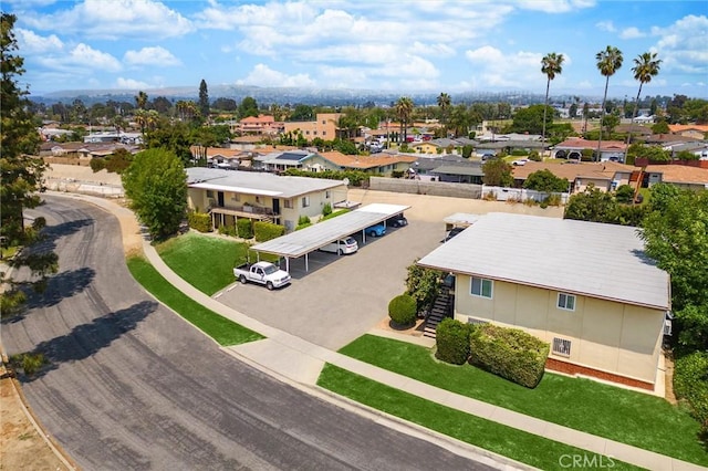 birds eye view of property with a residential view