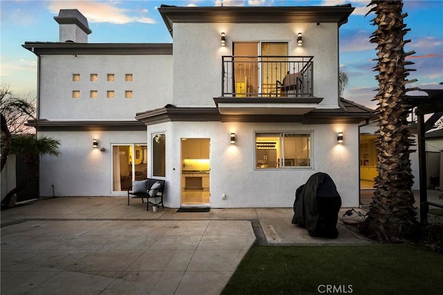 17846 Palora St, Encino, CA 91316 - back of house featuring a patio area, stucco siding, a chimney, and a balcony