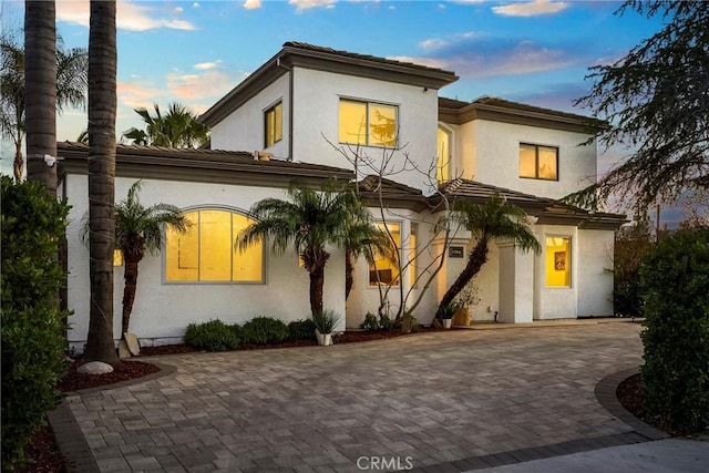 mediterranean / spanish-style home featuring stucco siding