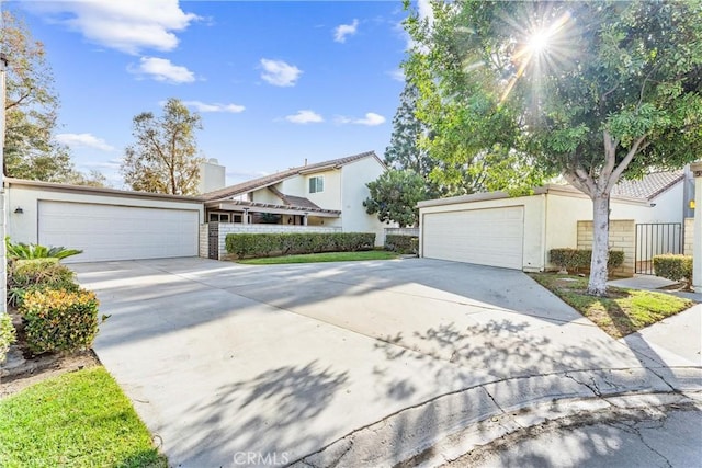 view of front of property featuring a garage and stucco siding