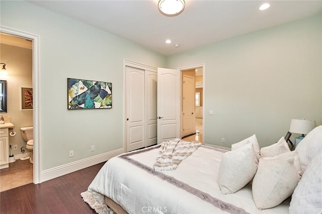 bedroom featuring dark wood-style floors, baseboards, a closet, and recessed lighting